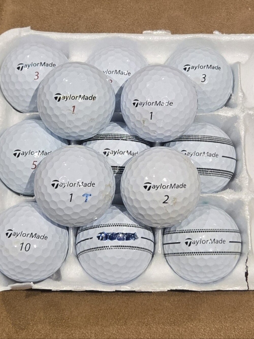 16 Taylormade TP5 and TP5x white golf balls. VG to excellent playing condition.